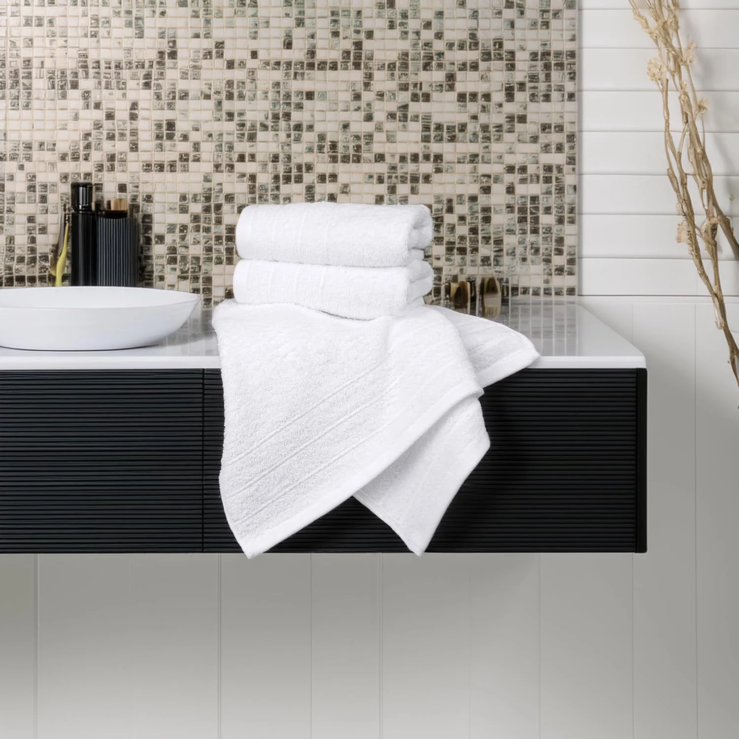 White towels on a dark vanity